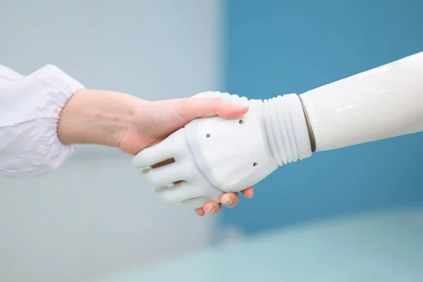 stock image Professional technician testing robotic bionic arm at prosthetic manufacturing, Technician checking and controlling artificial prosthetic hand, Technology at prosthetic manufacturing