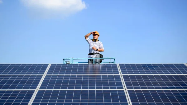 Professional technician worker installing solar panels at solar cell farm, Engineer working at power station, Electric system maintenance at solar panels field, Eco friendly and clean energy