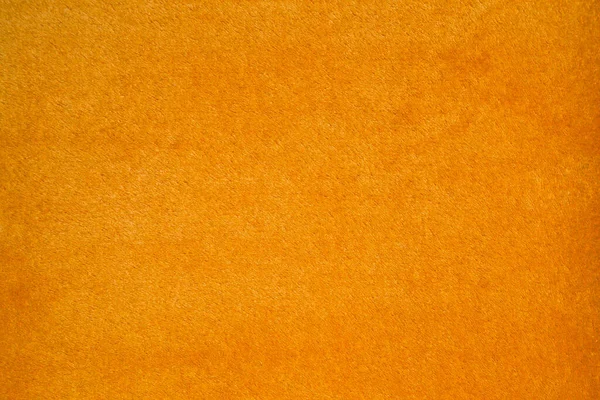 Orange fabric cover texture background blanket pattern. Blurred seamless background pattern.