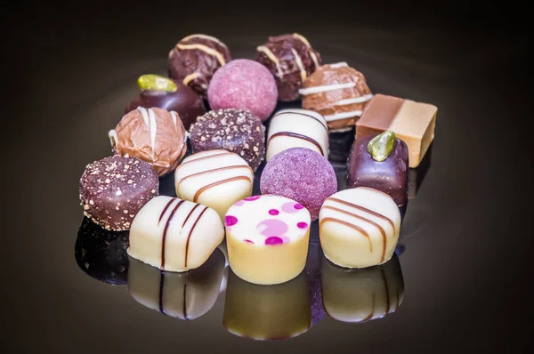 Assortment of colorful sweet decorated chocolate, candies and pralines.