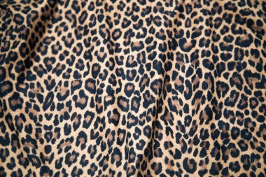 Leopard effect, fabric pattern. Background sample, seamless background print texture. Animal textile design.