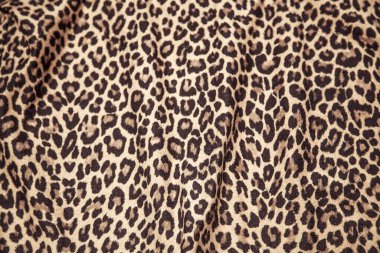Leopard effect, fabric pattern. Background sample, seamless background print texture. Animal textile design.