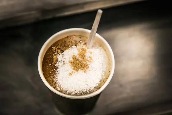 An Israeli salep with cinnamon. Popular middle eastern winter favorite sahlep. Sahklep made with milk, rose water, sachlav powder and sugar. Looks like cup of coffee.