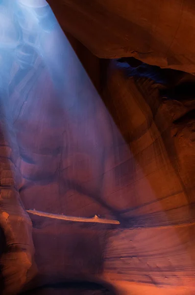 Light beams at Upper Antelope Canyon in the Navajo Reservation Page Northern Arizona. Famous and most photographed slot canyon in the world. Falling sand reflected in the light beam. Colorful sandstone formations are popular destinations for hikers.