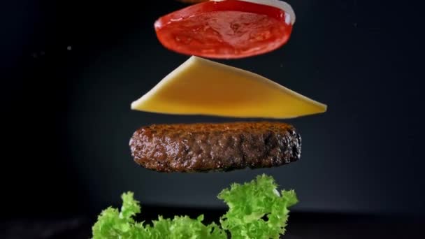 Beef Burger Ingredients Falling Landing Bun One One Slow Motion — Stock Video