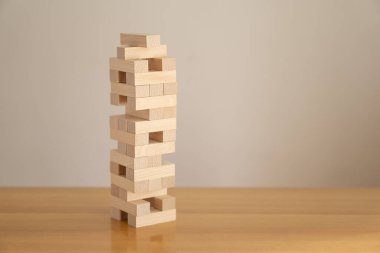 Tower of wood blocks. Concept of education, development, growth and risk.