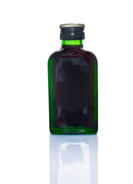 small green glass bottle isolated on white background. High quality photo