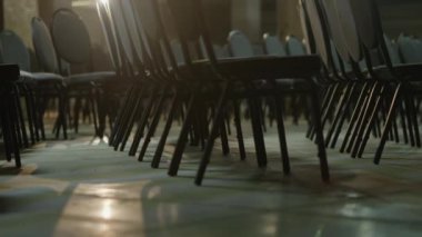 Empty convention hall center, camera movement through the rows of chairs in an office building, bottom view, evening scene, slow motion. Remote working changed everyday routine.High quality 4k footage