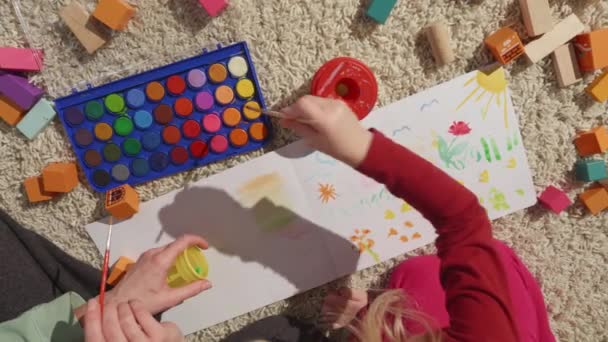 Top View Mothers Daughters Hands Painting Together Furry White Carpet — Vídeo de Stock