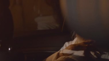 Thoughtful woman face, beautiful lady sitting in the car, light flashes from passing cars outside, night scene. Being alone, been vulnerable, sad and lost. High quality 4k footage