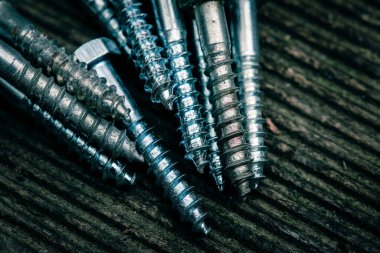 Different Kind of Screws on a table in a workshop