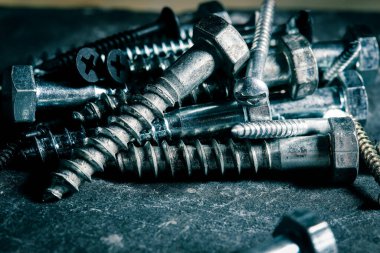 Different Kind of Screws on a table in a workshop