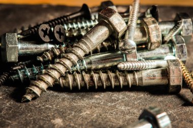 Different Kind of Screws on a table in a workshop