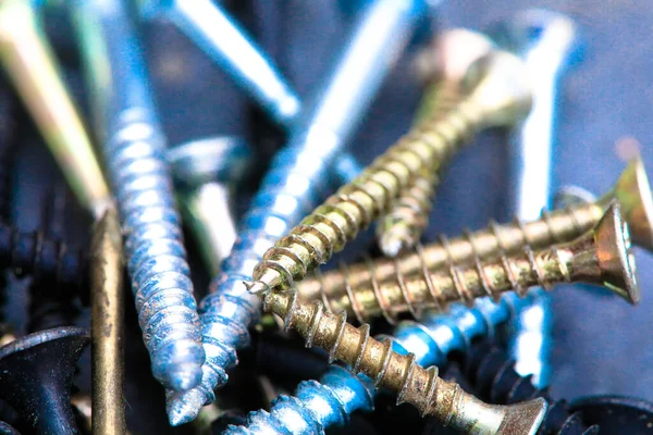 Different Kind of Screws on a table in a workshop