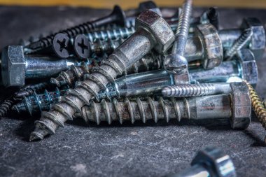 Different Kind of Screws on a table in a workshop