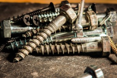 Different Kind of Screws on a table in a workshop