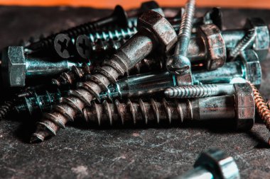 Different Kind of Screws on a table in a workshop