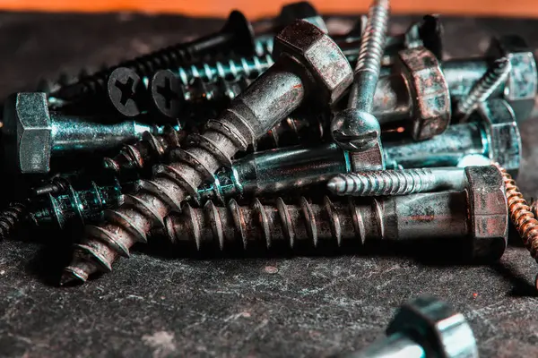 Different Kind of Screws on a table in a workshop