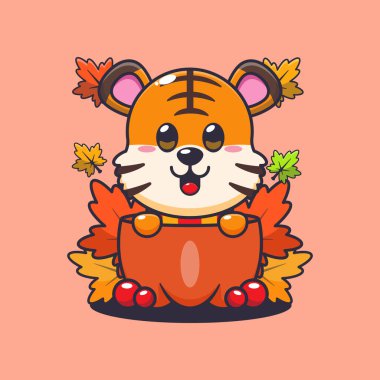 Sonbahar mevsiminde balkabağında tatlı bir kaplan. Maskot karikatür çizimi poster, broşür, ağ, maskot, etiket, logo ve simge için uygundur.