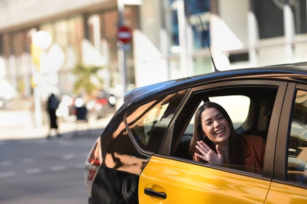 Girl Yellow Black Cab Barcelona Waving Car Window Waving Person — Zdjęcie stockowe