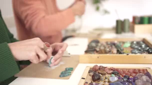 Detail Woman Hand Sanding Gemstone Background Man Weaving Bracelets Gems — Stock Video