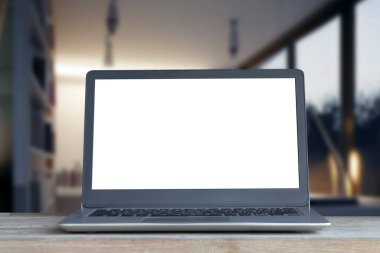 Ofiste ya da ortak çalışma alanında dizüstü bilgisayar, ekranda beyaz ve bulanık arkaplan ve çalışma alanı kavramına sahip dizüstü bilgisayar.