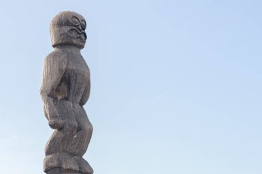 'Aumakua or family Hawaiian god represented in traditional form of wooden carved statue. Pu?uhonua o Honaunau national historical park, Hawaii, the USA. clipart