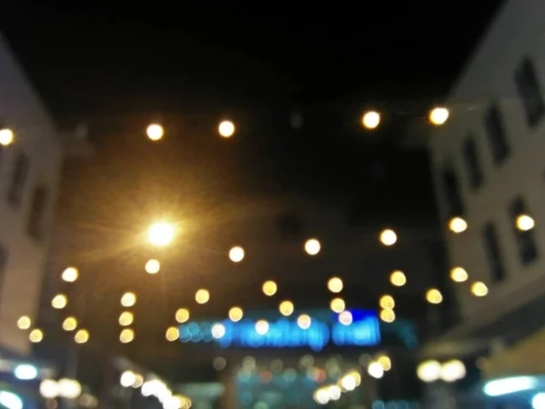 Bokeh of light in the city at night. blurred light background.