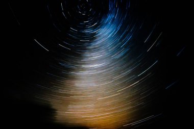 Beautiful star trails time-lapse at night clipart