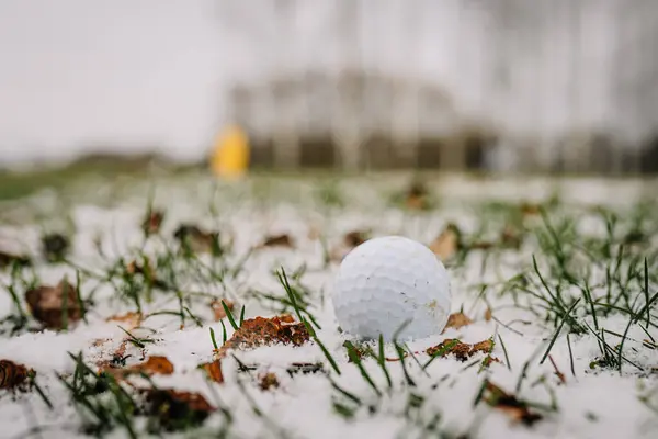 White golf ball in a golf snow game