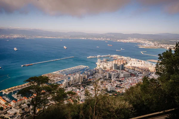 Gibraltar, Britain - January 24, 2024 - view from Gibraltar, overlooking the city, marina, and busy shipping lanes on a clear day.