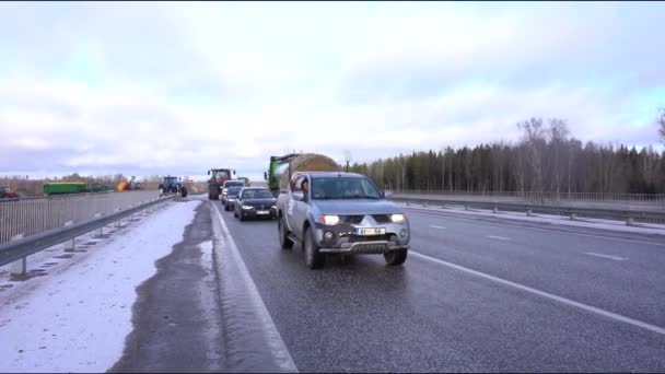 Valmiera Latvia February 2024 Caravan Tractors Trucks Snowy Road Cloudy — Stock Video