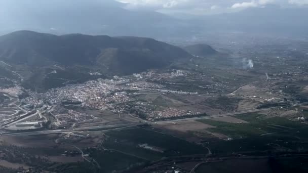 Aerial View Airplane Town Nestled Mountains Fields Roads — Stock Video
