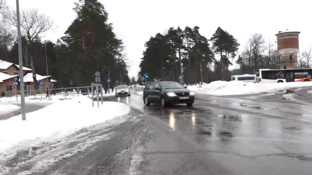 Sigulda Latvia February 2024 Wet Road Cars Driving Surrounded Snow — Stock Video