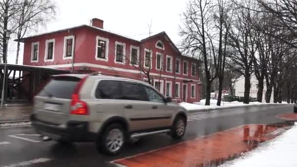 Sigulda Latvia February 2024 Red Building White Trim Wet Road — Stock Video