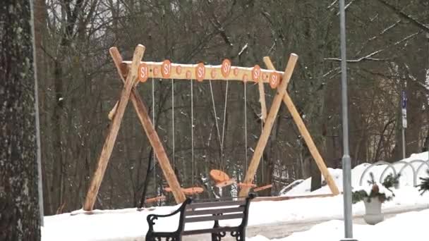 Sigulda Latvia February 2024 Wooden Swing Set Orange Seats Letters — Stock Video