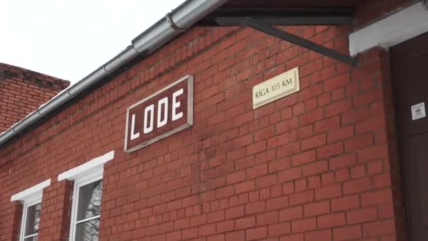 Lode Latvia February 2024 Close Red Brick Building Two Signs — Stock Video