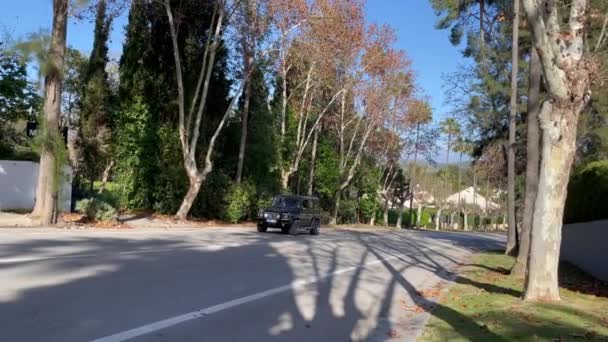 Sotogrande Spain January 2024 Black Suv Driving Road Trees Gated — Stock Video