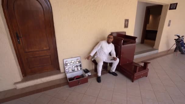 Agadir Morocco February 2024 Man White Shirt Pants Sitting Shoe — Stock Video