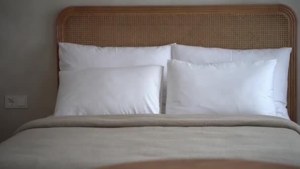 Close Neatly Made Bed Rattan Headboard White Pillows Textured Beige — Stock Video