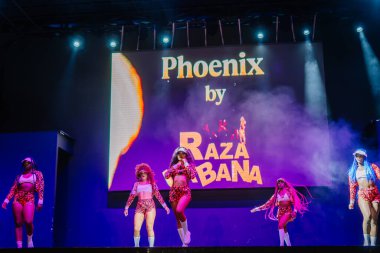Kemer, Turkey - September 21, 2025 - Dancers perform in colorful outfits under dramatic stage lighting during a dynamic Raza Urbana show, creating an electrifying atmosphere full of movement and energy.