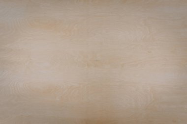 Açık renkli ahşap bir yüzeye yakın çekim, doğal tahıl ve düğümler, arka plan veya malzeme kullanımı için ahşaptaki dokuyu ve ince desenleri gösterir.