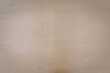 Açık renkli ahşap bir yüzeye yakın çekim, doğal tahıl ve düğümler, arka plan veya malzeme kullanımı için ahşaptaki dokuyu ve ince desenleri gösterir.