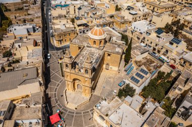 Village of Marsaxlokk in Malta on background