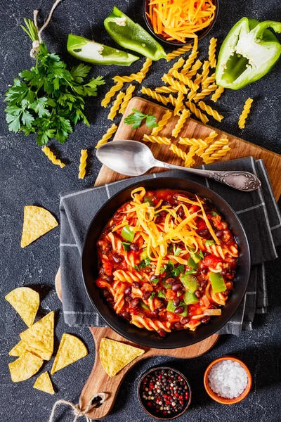 Black Bean Soup Spiral Fusilli Pasta Vegetables Topped Shredded Cheese — Stock Photo, Image