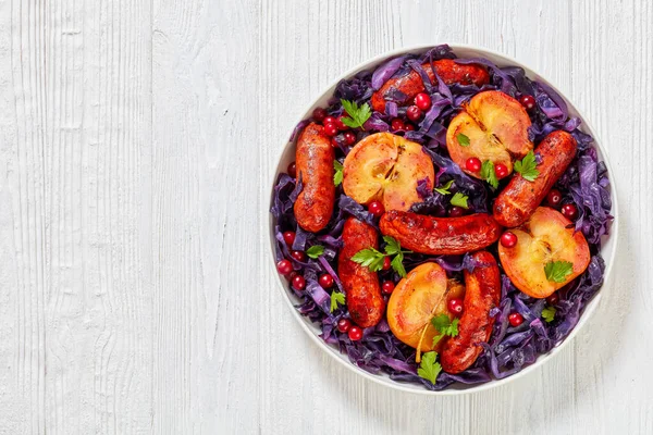 Seared Sausage Red Cabbage Apples Cranberries White Plate Wood Table — Stock Photo, Image