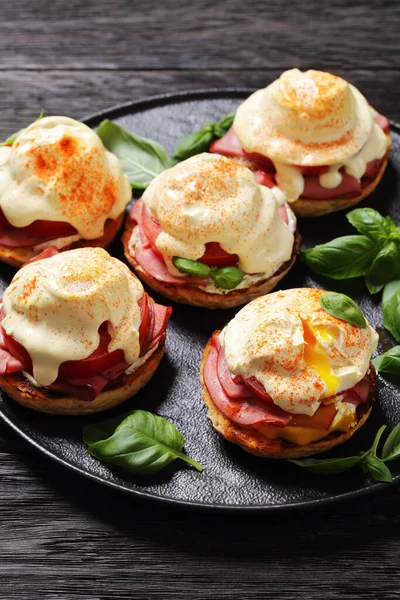 Close Eggs Benedict English Muffin Soft Cheese Ham Tomato Basil — Stock Photo, Image