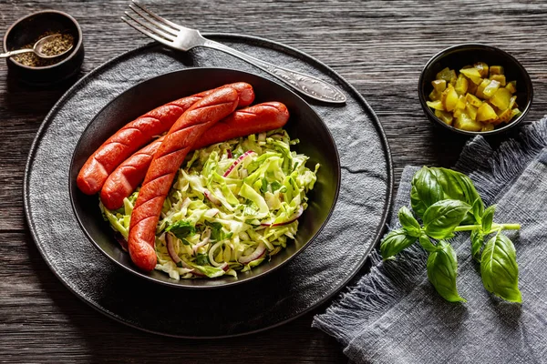 Juicy Cooked Sausages Classic Coleslaw Salad Black Bowl Dark Wooden — Stock Photo, Image
