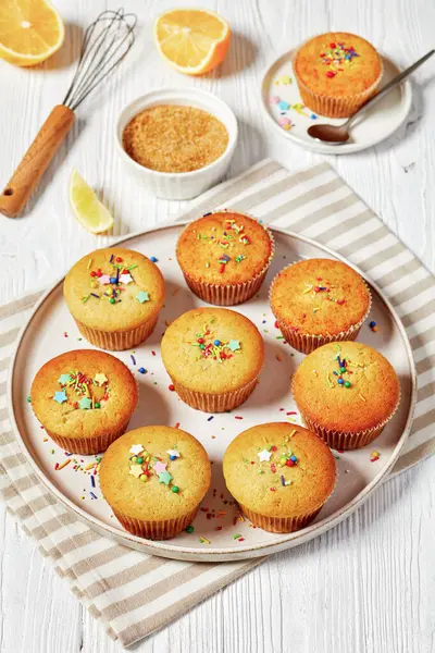Delicious Sweet Lemon Muffins Topped Holiday Sprinkles White Plate White — Stock Photo, Image