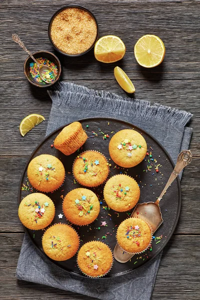 Moist Sweet Lemon Muffins Topped Holiday Sprinkles Black Plate Dark — Stock Photo, Image